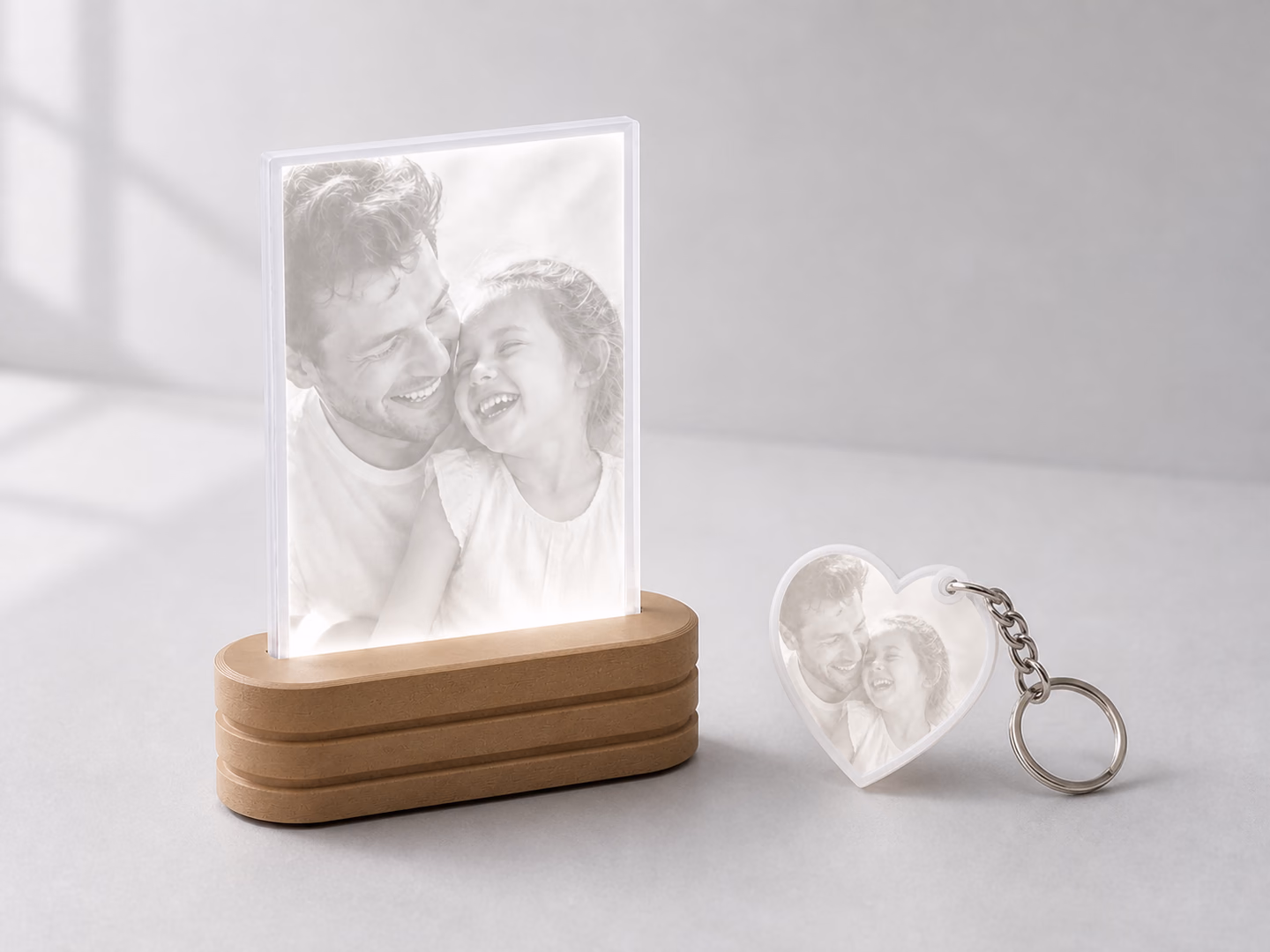 A complete Photo Light and matching heart keychain shown together at realistic scale.
