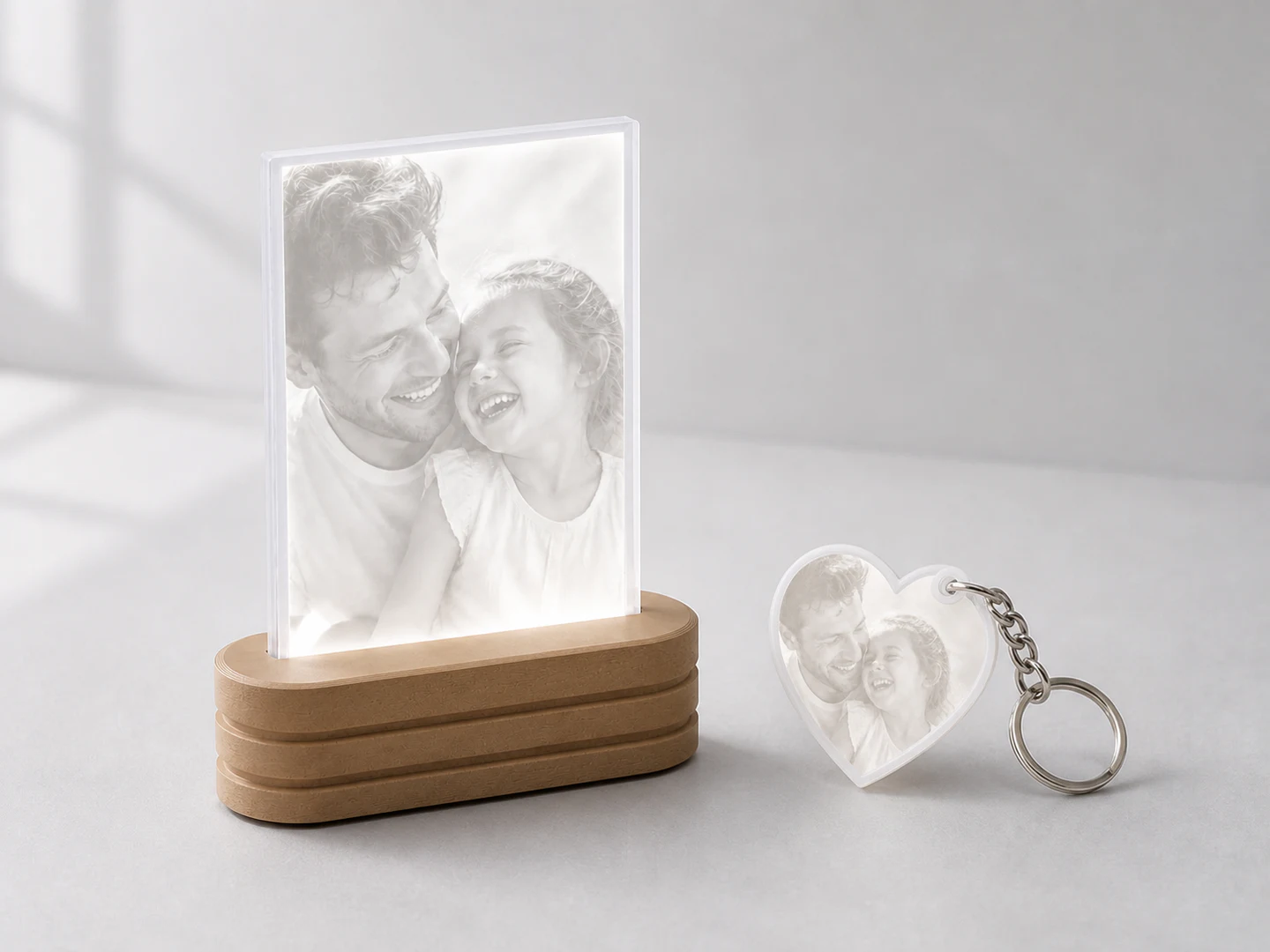 A complete Photo Light and matching heart keychain shown together at realistic scale.